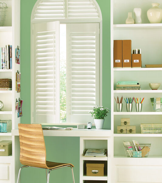 home office with green walls and Hunter douglas cordless plantation shutters in Reno