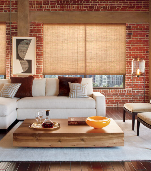 rustic living room with cordless child safe provenance woven wood shades by Hunter Douglas Reno