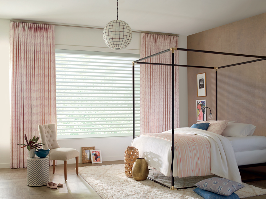 Reno bedroom with shades from Design Studio Window Treatments collection.