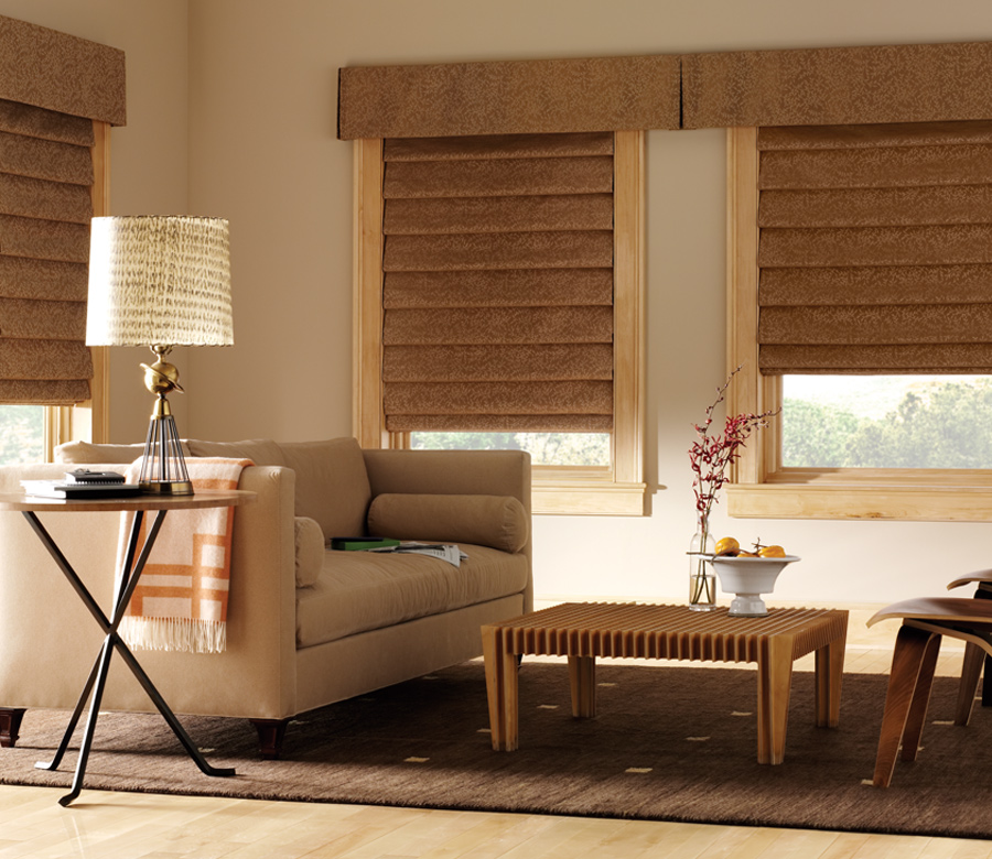 camel colored fabric roman shades with coordinating cornices Reno NV