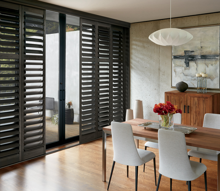 floor to ceiling window treatments dark plantation shutters sliding track Reno NV