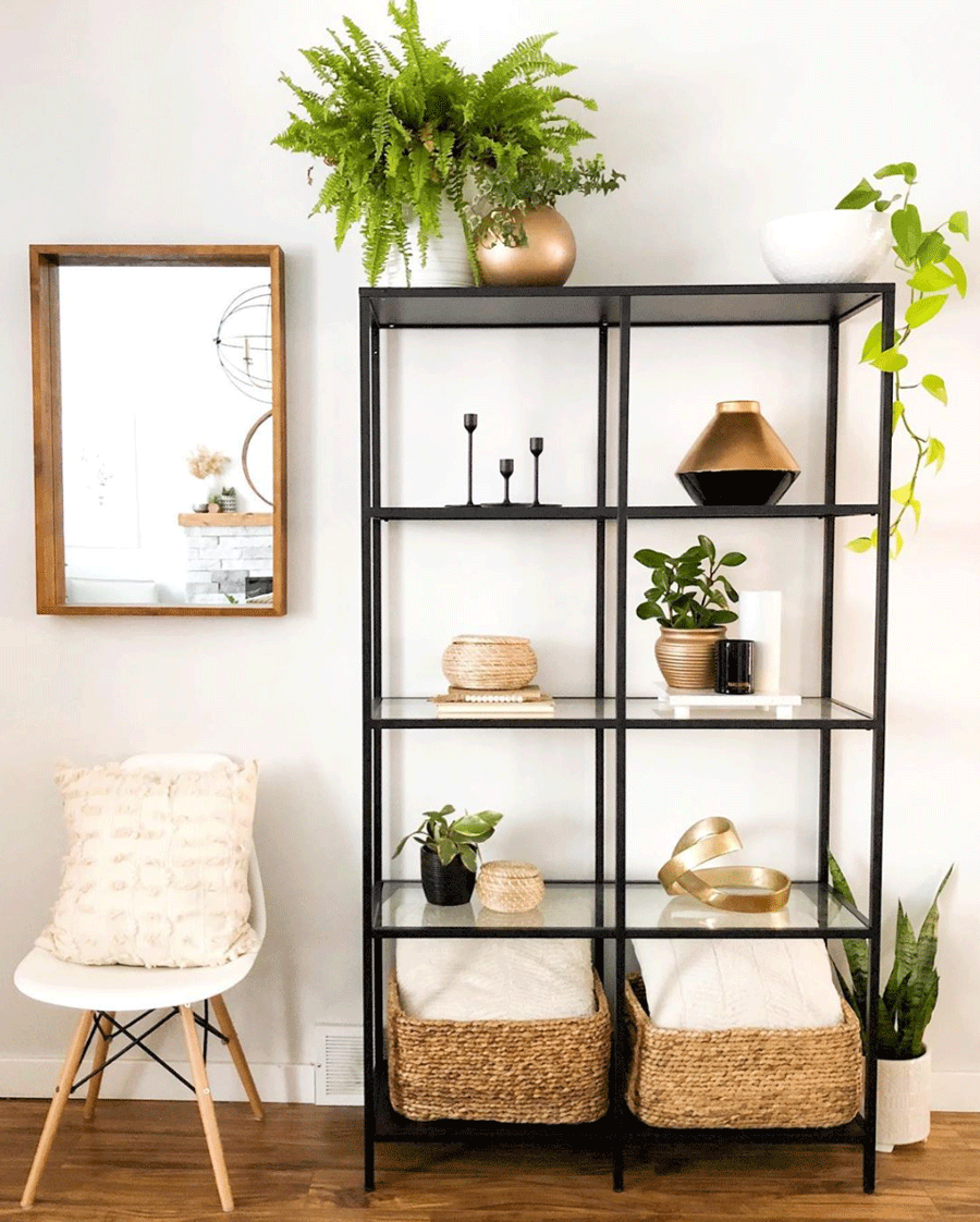 Accents of gold on black shelf