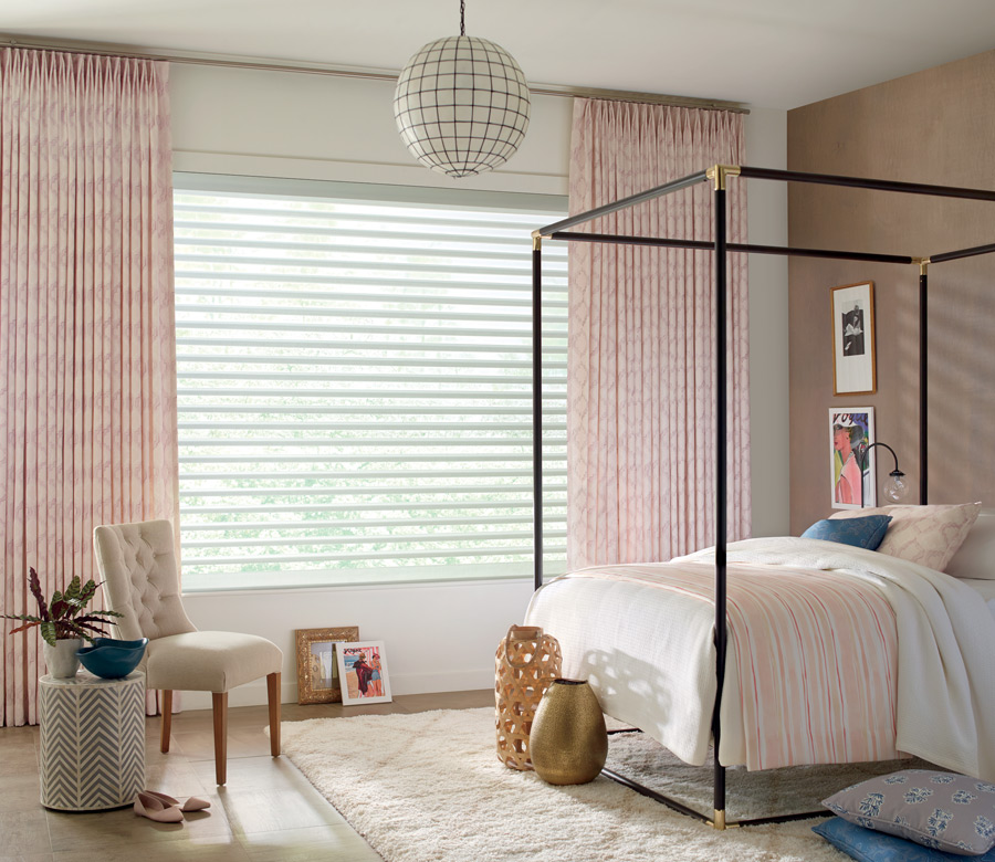 soft pink custom draperies with white window shades bedroom in Reno NV