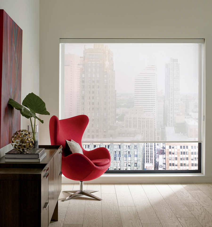 A living room with Designer Screen Roller Shades with 10% Openess Factor