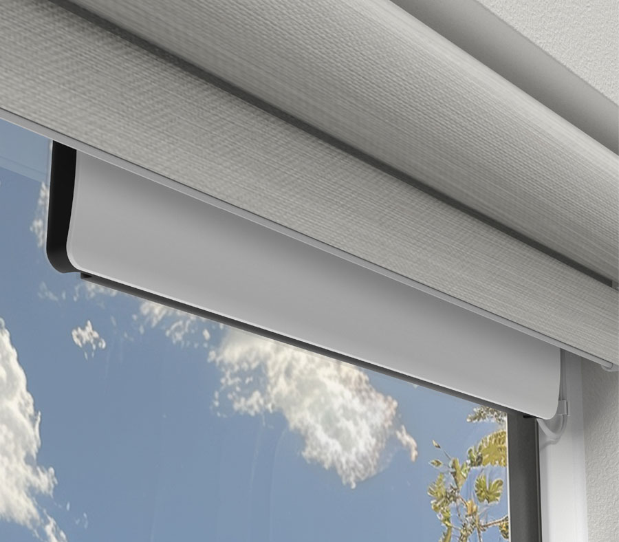 Hunter Douglas solar charger attached inside the window powering the rechargeable battery wand for continual charging