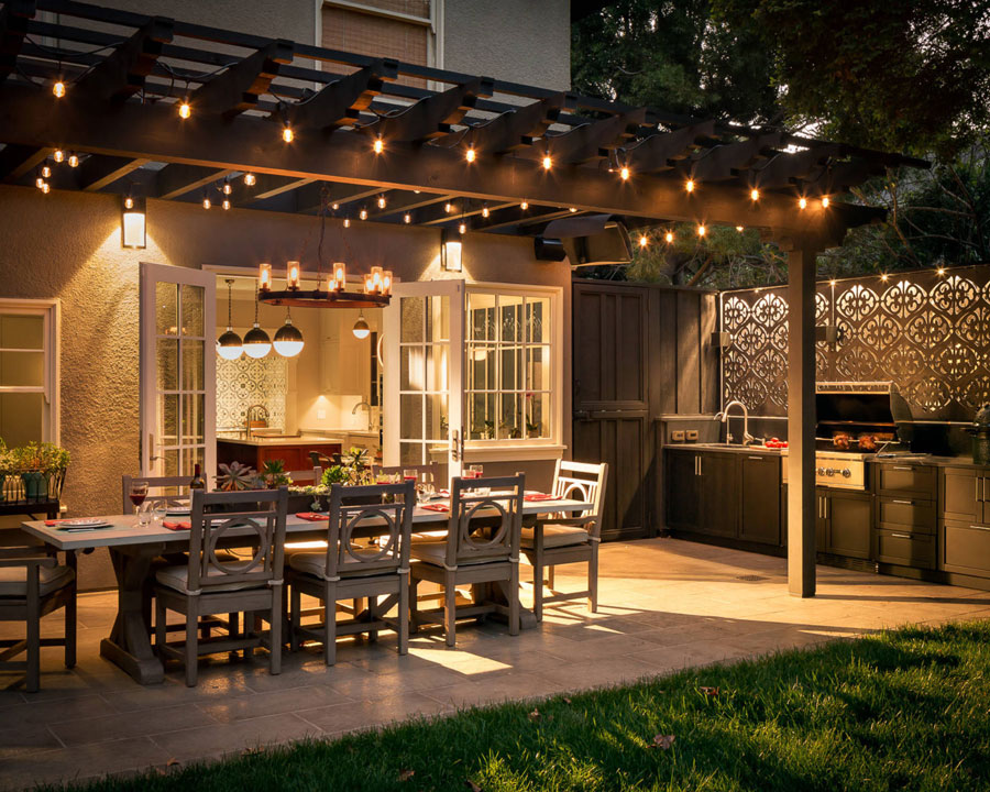 Outdoor patio with dining table and lights