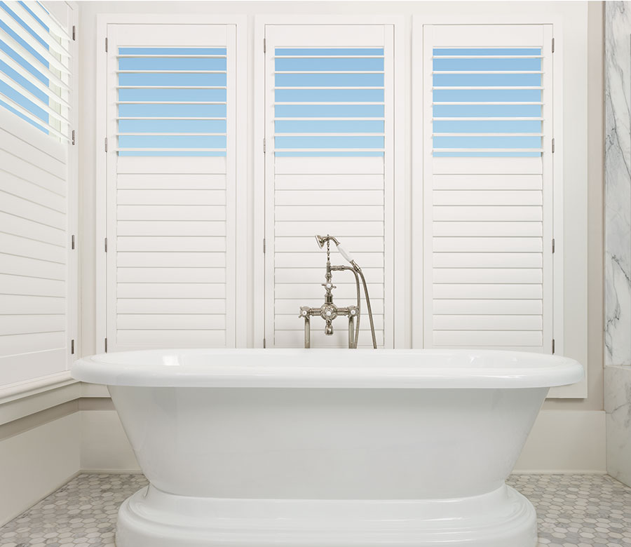 Bathroom view of top down feature shutters in bathroom of Reno home