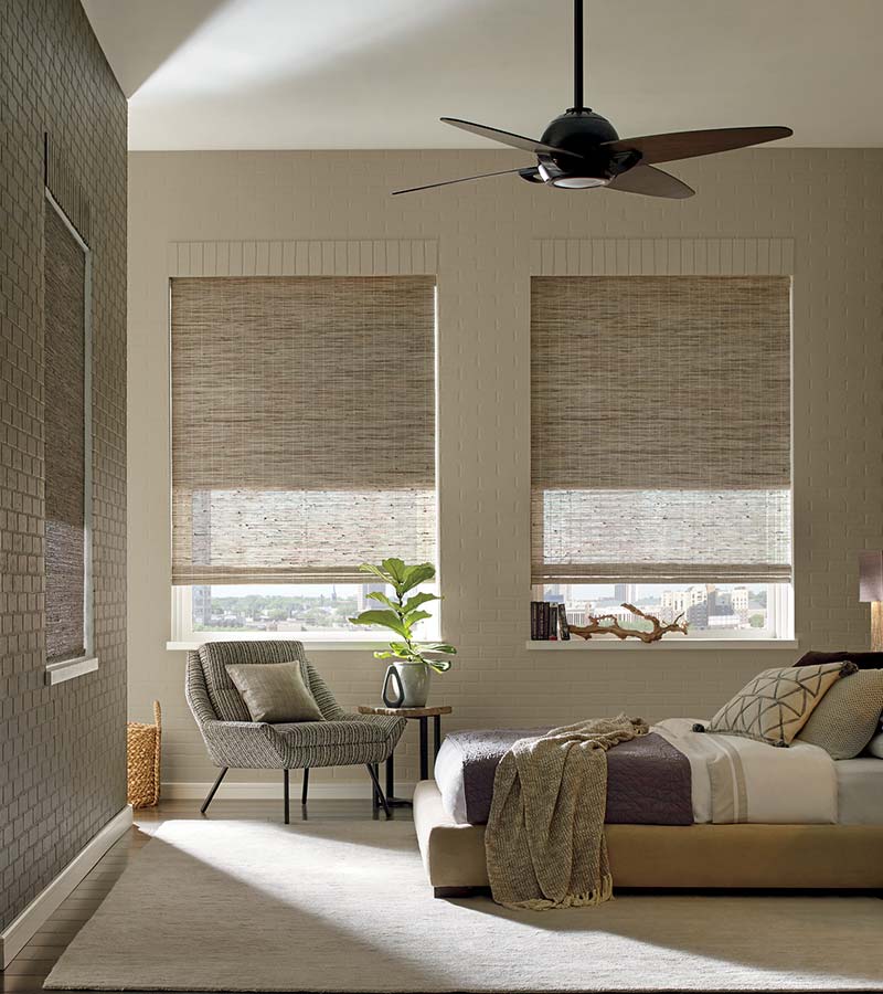 beige bedroom with room darkening dual opacity woven wood shades