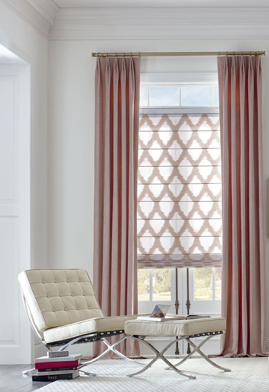 rose color drapery and pink patterned roman shades in these fabrics enhance