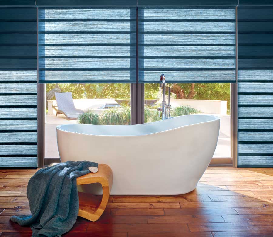 modern bathroom standalone tub with hunter douglas blue vignette modern roman shades Reno