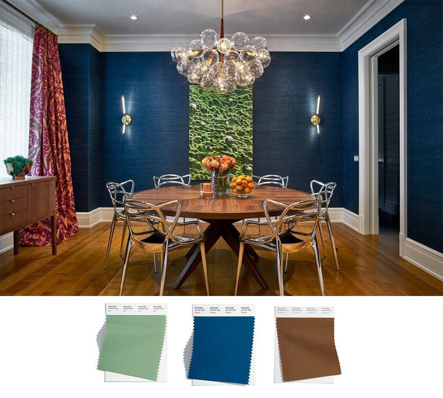 navy blue dining room with warm wood accents and grasscloth backdrop