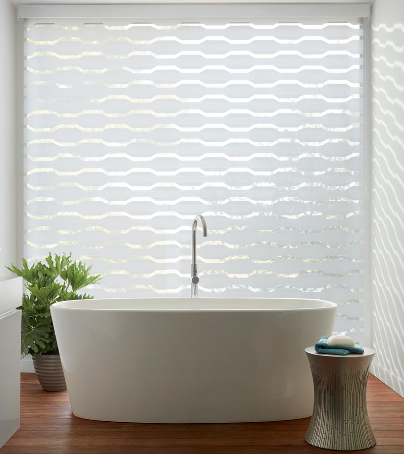 geometric pattern window shades with automation in white bathroom