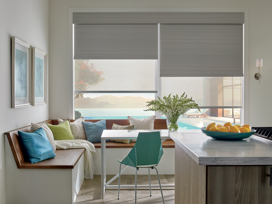 Breakfast nook with smart roller shades