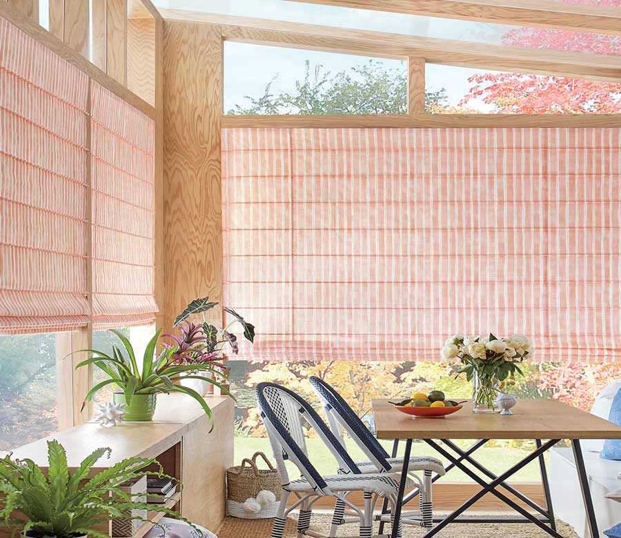 outdoor sunroom with coral striped pattern window shadings Reno, NV