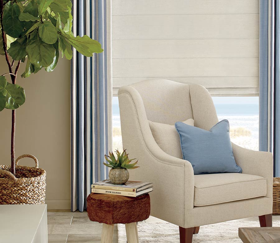 traditional living room blue and cream striped designer shades in cozy home