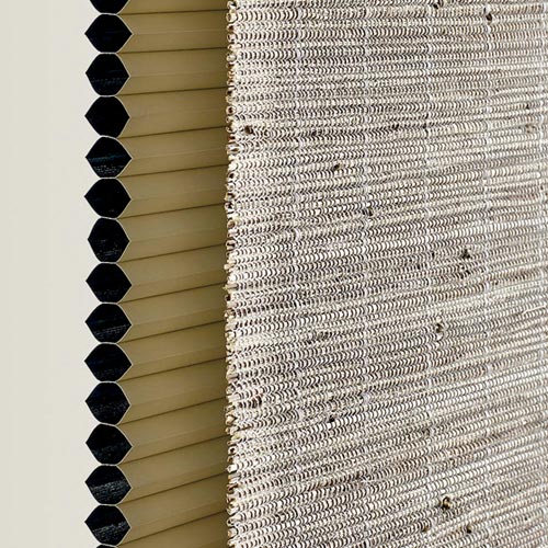 sideview of woven shade with a honeycomb dual shade behind Reno, NV