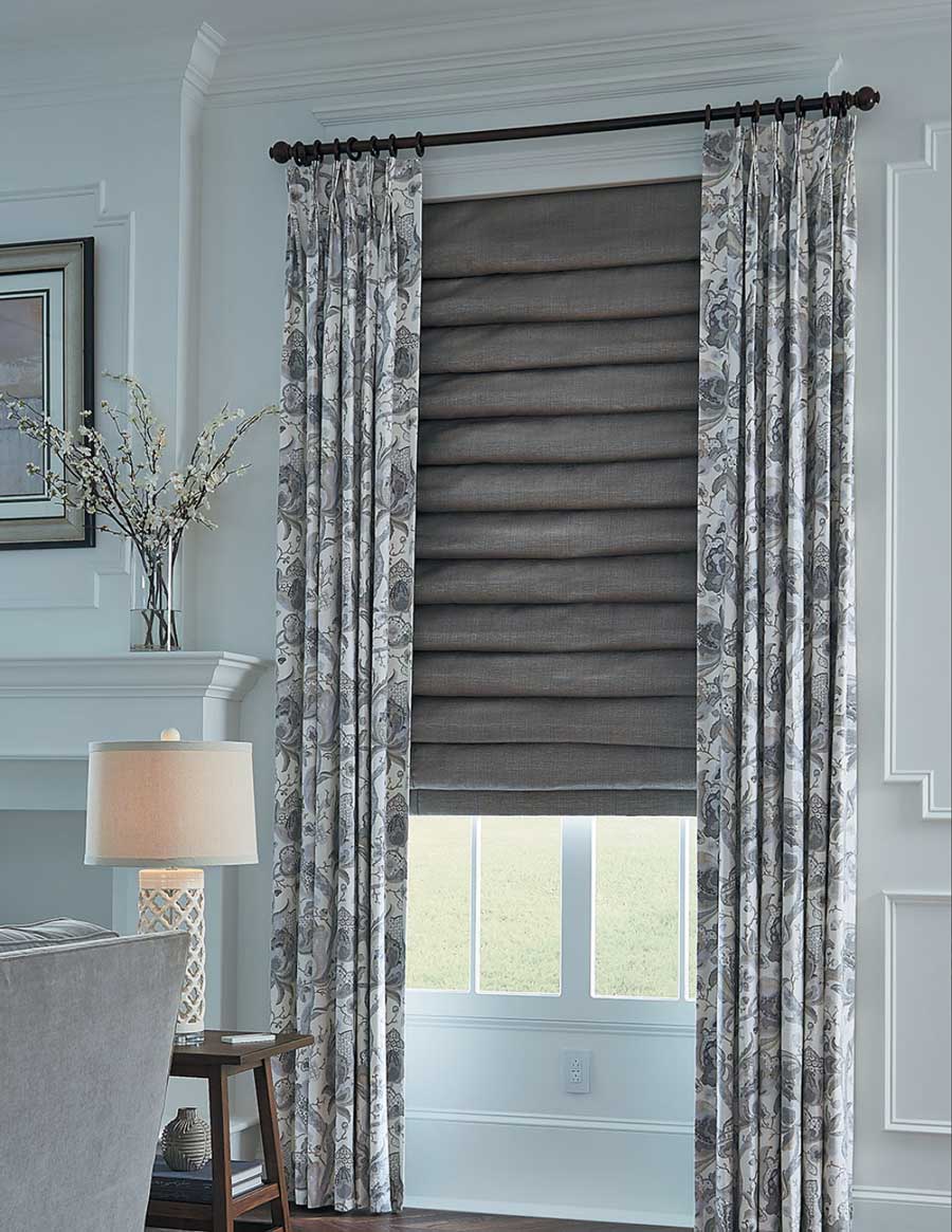 roman shades with patterned drapery in living room in reno nv