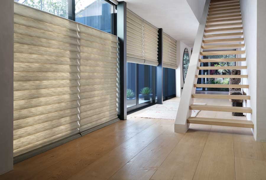 top down shades in a modern home with a center staircase