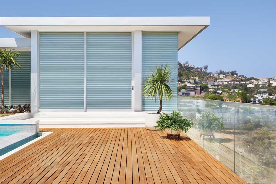 outside view of patio room with shades on the inside