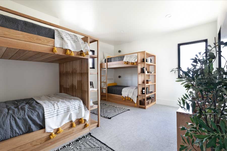 bunk beds in room with neutral color palette