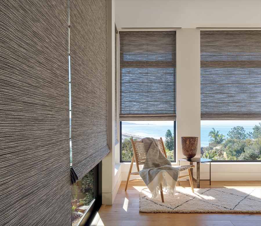 Alustra Woven Textures roman shades on tall windows for light filtering