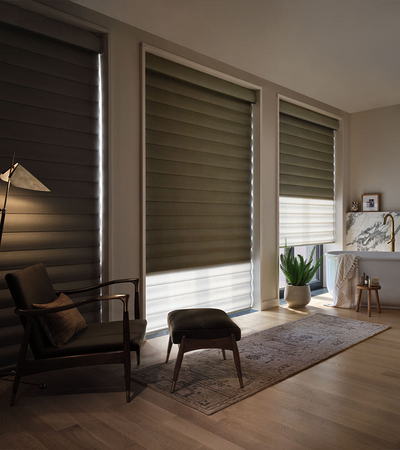three windows in living room with black out window shades in reno