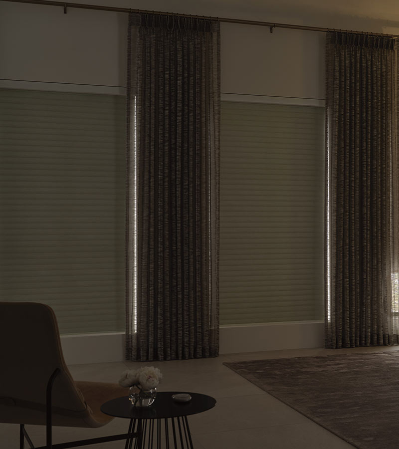 bedroom with drapery and white sonnette blackout shades