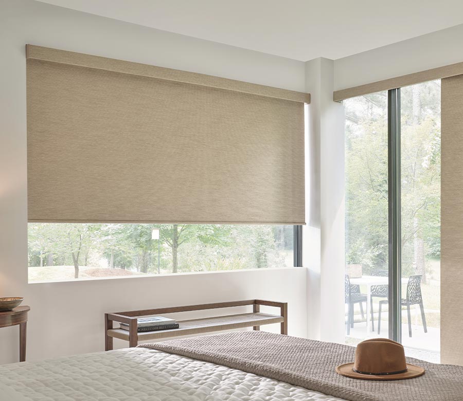 cream designer roller shades in bedroom