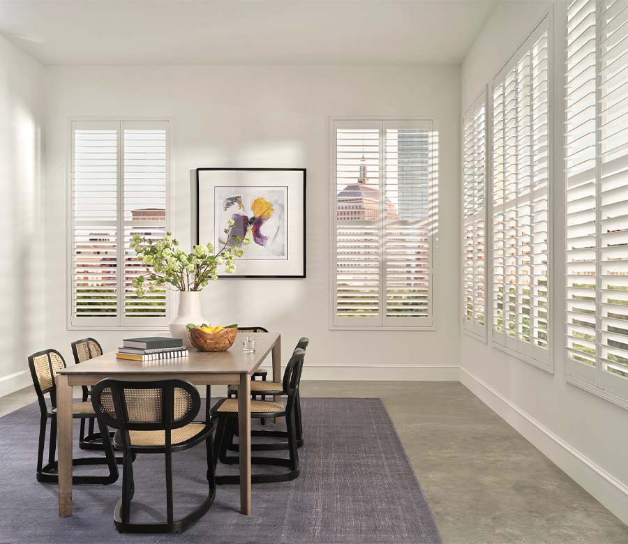 white palm beach vinyl shutters along wall in dining room