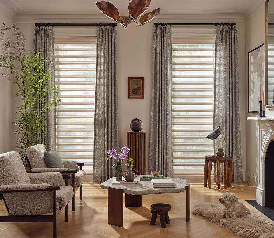 Pirouette window shades with curtains in living room during daylight