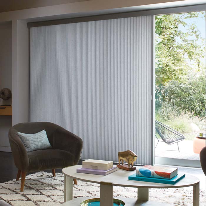 Vertical honeycomb shades on large sliding glass doors in Reno NV home