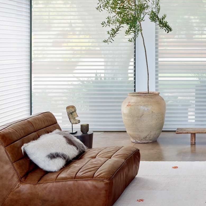 Silhouette Sheer Shades on floor to ceiling windows control the light and add daytime privacy with reduced glare in Reno living room