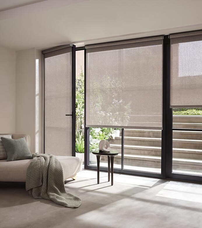 sheer-grey-designer-screen-shades-with-handle-blue-sky-shutters-and-shades gray designer screen shades on glass doors leading to outside stairs